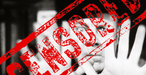Black and white picture of a man superimposed with a red stamp that reads "Censored"